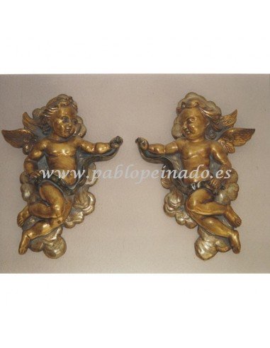 Pareja de ángeles madera dorados:

Dimensiones: 38 x 52 x 10 cm 