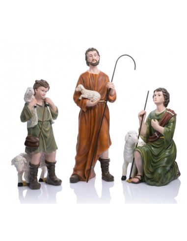 Con junto de imágenes compuesto por tres pastores.
Un pastor niño que viste de verde con un chaleco de lana y un zurrón marrón