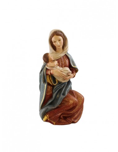 Virgen con niño de madera.
Dimensiones: 40x21 cm.