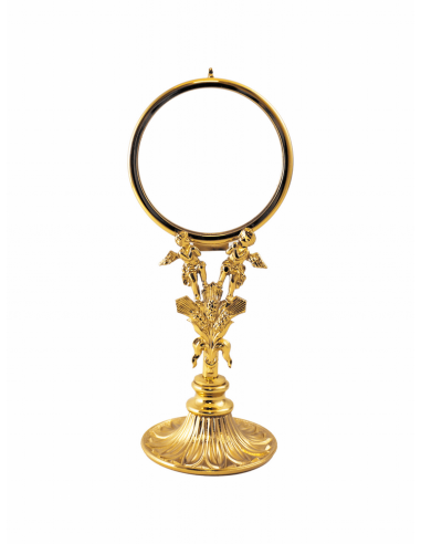 Ostensorio dorado con nudo decorado con trigo y ángeles.
Interior de 7 cm de diámetro.
Dimensiones 19.5 cm de alto x 8.5 cm d