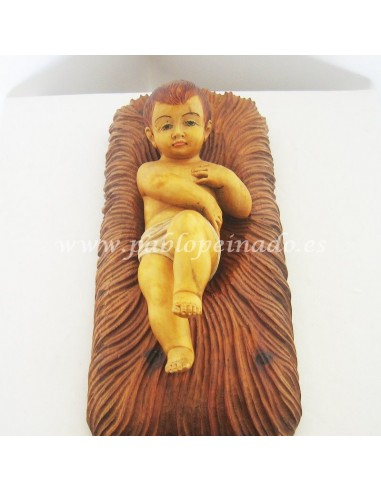 Imagen de Niño Jesús y cuna en madera tallada y policromada. Dimensiones: 30 cm.